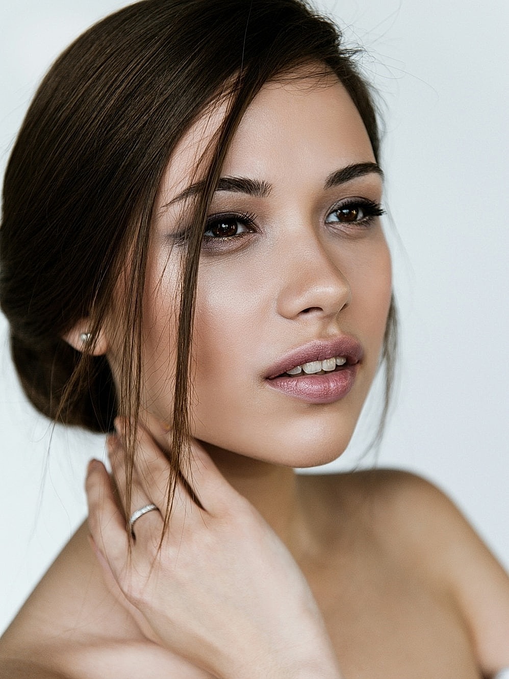 Profile of a woman against a light background.