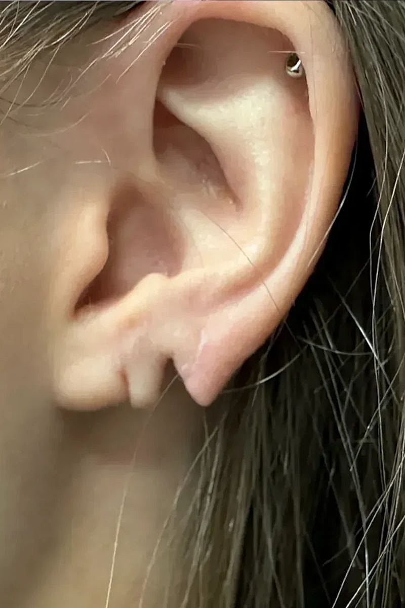 Close-up of an ear with a piercing.
