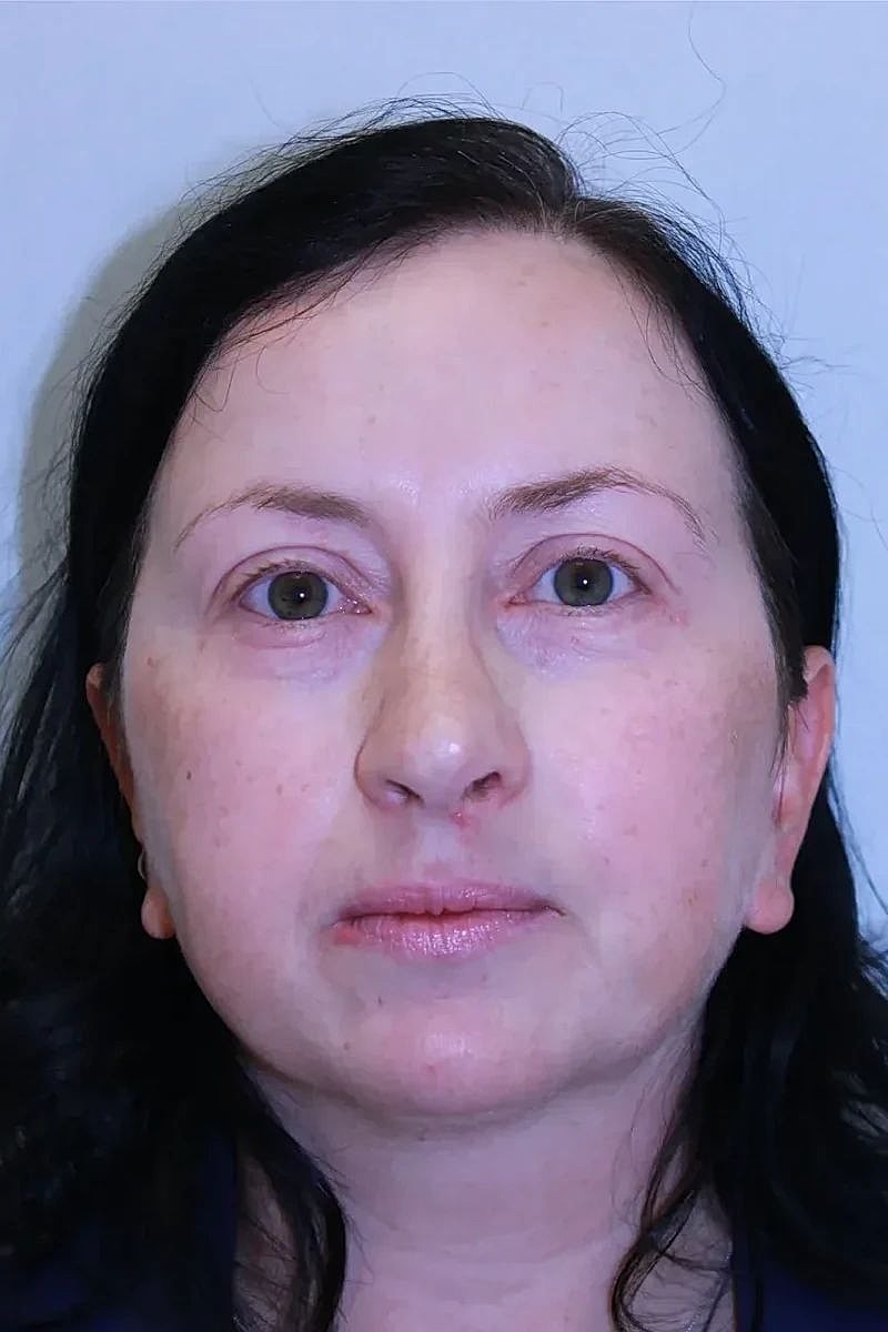 Close-up portrait of a woman with dark hair.