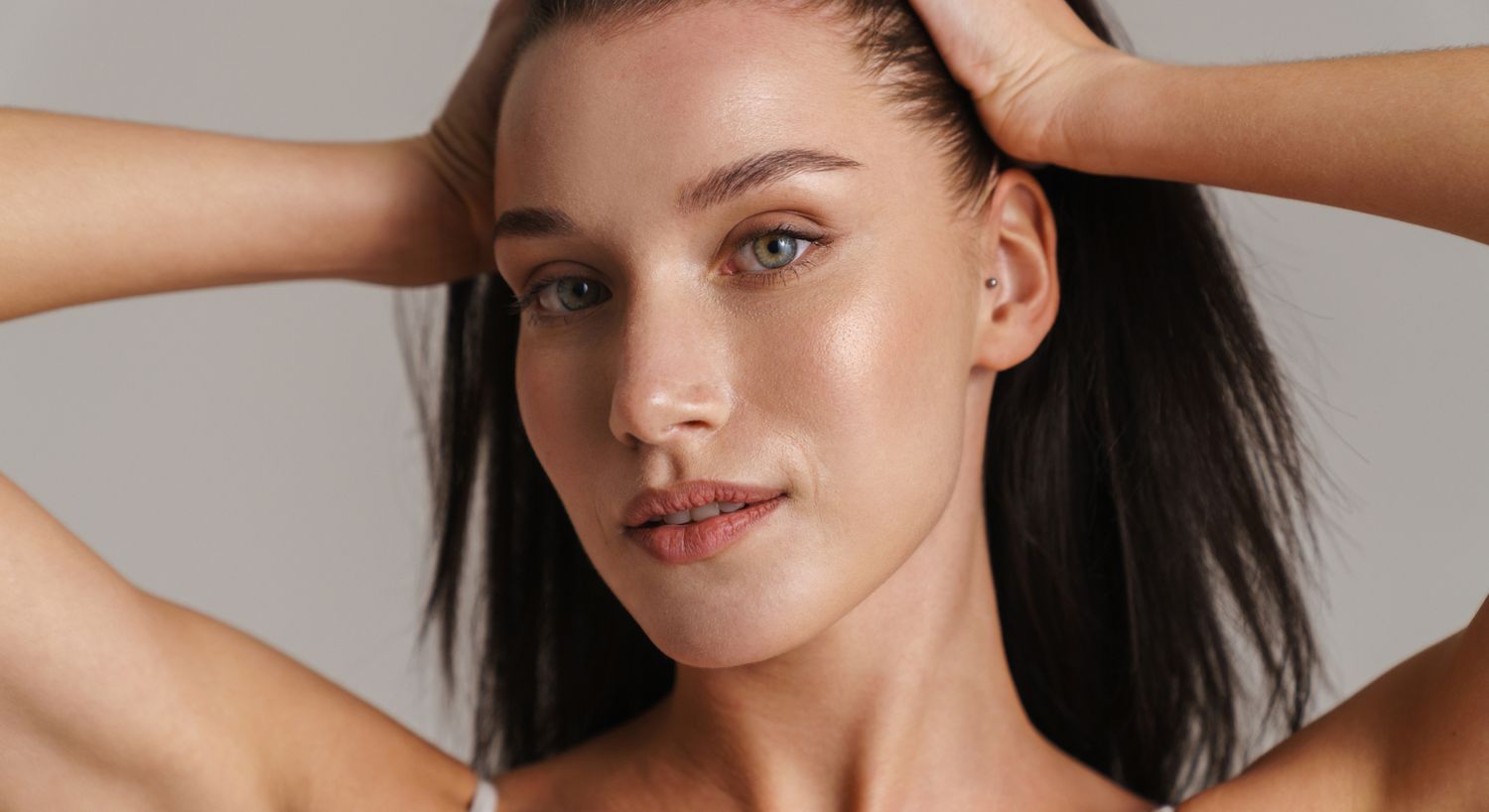 Woman with long hair and natural makeup.